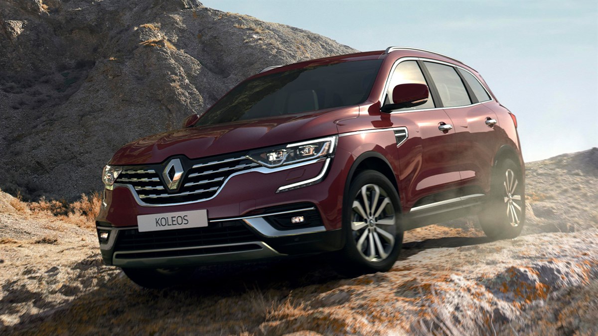 Front exterior design of the All-New Renault KOLEOS moving in a rocky hilly area